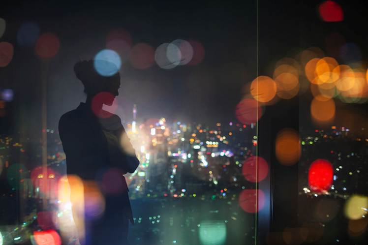 A silhouette of a person standing in front of a window
AI-generated content may be incorrect.